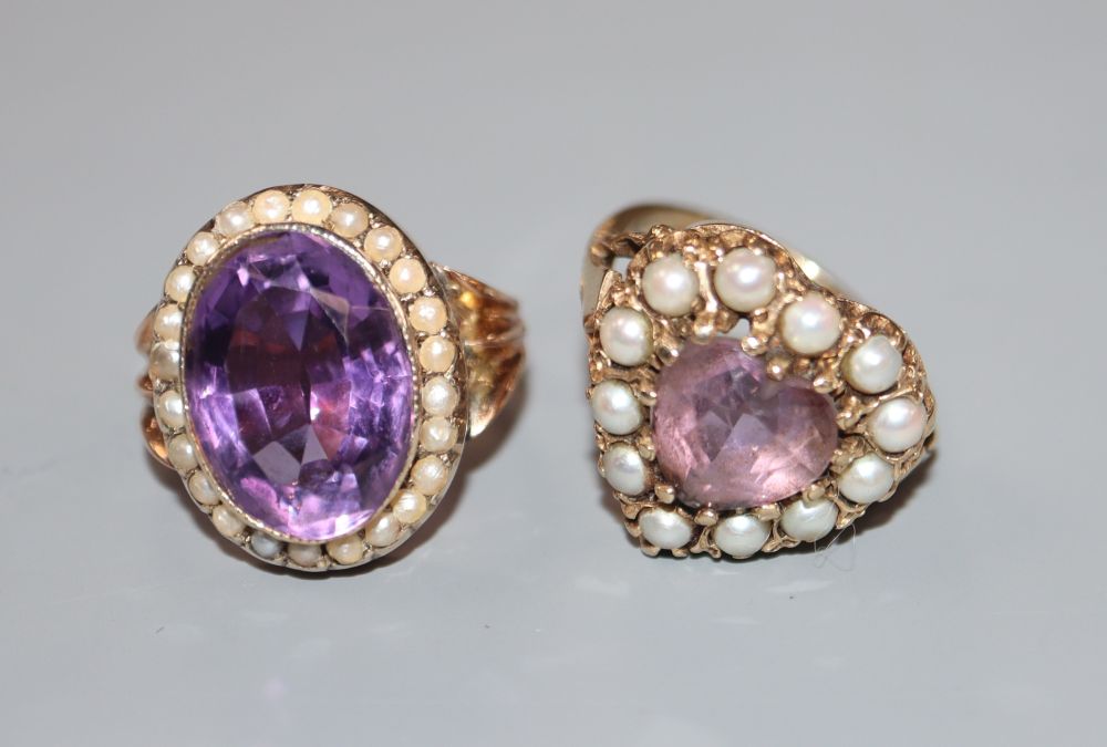 Two early 20th century yellow metal, amethyst and seed pearl set dress rings